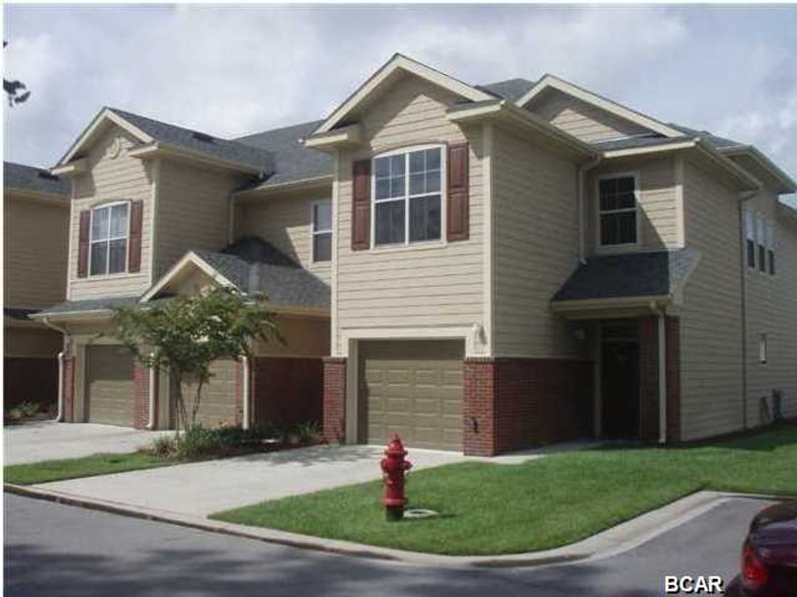 Baldwin Rowe Circle Townhomes. This is a gated community. Beautifully landscaped, community pool and clubhouse. It has two separate heat pumps, one upstairs and one downstairs. Hardwood floors, tile and carpet. Screened porch and a single car garage. No Pets Please.