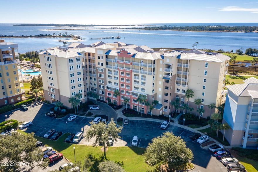 This property has sold! Discover similar listings by reaching out to us for an updated list of available properties that match your preferences. Enjoy true condominium living from this 5th floor unit at Grand Residences in Bay Point. Featuring two bedrooms, two full bathrooms, living and dining, spacious kitchen and BONUS ROOM (could be a great office or sitting room), this unit is in excellent condition. Overlooking the two beautiful water holes on the Nicklaus Golf Course and also the bay, views from this balcony are absolutely fantastic. This unit comes with a dedicated parking space and also a storage room just steps from the condo. Bay Point offers golf, a marina, spa and restaurants. Also, Grand Residences is in the gated section of the community for added security. Make it a point to see this beautiful unit today.