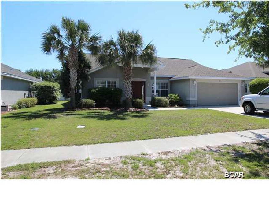 VACANT AND EASY TO SHOW.  PRICE REDUCED BY $10,000.  This is a really nice 4bd 2bth home on a premium lot in Palmetto Trace. We have a bid on new Carpet at $2,635 and exterior painting at $2,200 plus paint.  The lot is located on one of the neighborhood lakes and it has the longest view of the lake.  No neighbors in the rear and not looking at the commercial area. Privacy fenced yard, deck, screened porch, vaulted ceilings, HUGE master bath with garden tub. Separate shower, separate sinks, separate walk-in closets and separate vanities in master. Arched doorways, ceramic tile, great kitchen layout and breakfast nook area. Palmetto Trace has easy access to Pier Park and the beach. Golf cart friendly all the way to the beach through Pier Park CARPET QUOTE FROM CHUCK AT CARPET CONNECTION AT $2,635