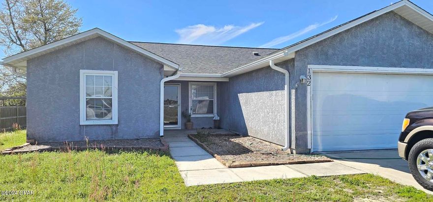 Lovely 3 bedroom 2 bath stucco home in Callaway. Situated on a large corner lot, this wonderful home is convenient to Tyndall AFB, the local bay, waterways and of course our famous white sand beaches. The entrance has a spacious courtyard type surrounding with plenty of room for flowers, plants and landscaping to your hearts content. The living room has a high vaulted ceiling giving a more spacious feel and the split bedroom floor plan is very desirable. The kitchen is spacious with ceramic tile flooring, and has an eat-in breakfast/dining area. The 2 additional bedrooms and hall bath are just off the opposite side of the living room. The home has laminate flooring in the living room, ceramic tile in the wet areas and carpet in the bedrooms.  A nice sized master bedroom is just off the dining area. The master bathroom features a double vanity with a separate private bathing and toilet area. The combination tub/shower also has a jetted tub. The roof was replaced in 2019 after Hurricane Michael and the water heater was replaced in 2019. All dimensions and information is deemed accurate, buyer should verify any dimensions and information that is important to them.