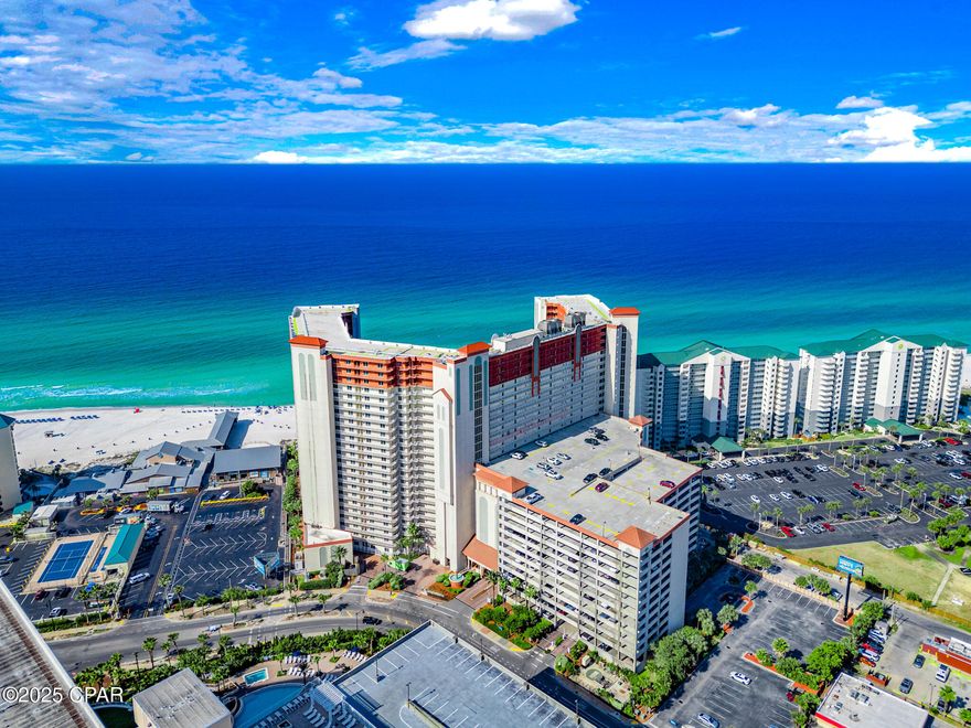 >>On Sale >>> Welcome to the 21st floor of Shores of Panama where the unbelievable views in this west-facing corner unit are JAW-DROPPING and the vibes are top tier! This 3-bedroom, 3-bathroom delivers panoramic Gulf views that stretch as far as the eye can see, right from your living room and private balcony. It's the perfect mix of laid-back luxury and serious investment potential.

Step inside to a bright, open layout with plenty of space for you and your guests to kick back. The kitchen is fully equipped with granite counters, stainless steel appliances, and a breakfast bar made for early coffee or late-night cocktails. Tile floors throughout make beach living easy, while large windows frame that emerald coast like a masterpiece.

Downstairs, the resort-style lagoon pool is the real showstopper! One of the biggest in the area, surrounded by tropical landscaping, waterfalls, and a full-service tiki bar for those poolside drinks. You'll also enjoy a hot tub, indoor pool, gym, and of course, private beach access that puts you inches away from sugar-white sand. The ultimate coastal playground!

Located right next to iconic Pineapple Willy's, you're walking distance to dining, entertainment, and nightlife. Whether you're looking for a full-time escape, a weekend getaway, or a rental powerhouse, this unit checks all the boxes, and it's priced to move!

Unbeatable views. Unmatched amenities. Unbelievable price. Call today to check out the views for yourself!
