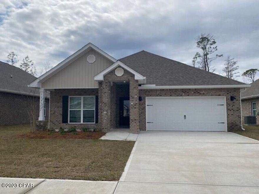 Andrews Park is centrally located off 389 in the very desirable area off Lynn Haven. Our Rhett floorplan is all brick, 4-bedroom 2-bath, it is an open concept floor plan, with a boasting 1,835 sq.ft.  The Rhett floorplan has upgraded finishes throughout. You will find 9-foot ceilings with 10-foot trays and beautiful crown molding. The Rhett also has LVP flooring, granite countertops, a large kitchen island with cabinetry on both sides underneath and brushed nickel hardware.  This floorplan has energy efficient windows to allow lots of beautiful natural light.  The primary bathroom has a beautiful garden tub, perfect for relaxing, and a spacious walk in shower with a glass enclosure. All of these homes come with Deako lighting and Safe Haven smart home systems. Andrews Park homes feature irrigation systems with reclaimed water to help minimize your water expenses. All homes come with a landscaping and sod package as well as gutters. This particular home comes with our move in package:  window blinds, Whirlpool appliances including refrigerator, washer and dryer