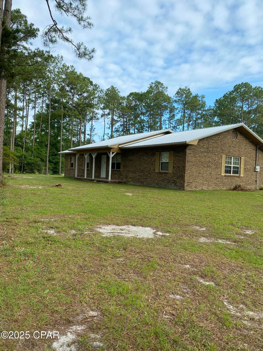 Another price improvement!!!!  Not going to  last much longer!  Grab this Gem while you can!!!!  Welcome to the farm.  Very nice 3/2 brick home is waiting for you and your family.  Property sits on 12 acres in the country part of Vernon Fl.  Walk into the front door and you' re met with a large family room with a beautiful wall to wall fireplace.  To the right side is a formal dining area.  Kitchen area is on the back side of the home with a small gathering area.  Very large utility room with a game room area which could be a 4th bedroom.
All rooms are very spacious.  
Property has several outbuildings.  2 pole barns (one enclosed) plus several smaller buildings.  
Property is located very close to the 
Choctawhatchee River and Holmes Creek area.