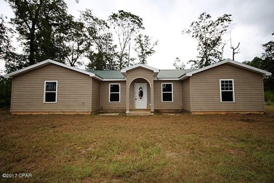 * PRICE REDUCED *  Large vinyl siding home situated on 4.91 secluded acres not too far from town.

The house has good design with repairs and renovations needed. If you are looking for a quiet and secluded location away from the hustle and bustle this is the one for you.  The large living/dining/kitchen has open airy design. It has split bedroom design with two bedrooms on each side of the house.