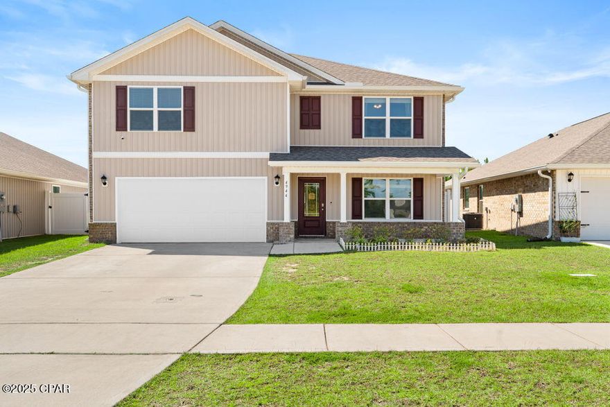 Welcome to 4944 Conner Ln in Panama City, FL a beautiful Hayden floor plan built in 2022, offering 5 bedrooms, 3 bathrooms, and 2,626 sq ft of well-designed living space. The open-concept main floor features a spacious kitchen with white cabinetry, stainless steel appliances, a walk-in pantry, and a large island that flows seamlessly into the living and dining areas, perfect for entertaining or family gatherings. Vinyl plank flooring runs through the main living spaces, while carpeted bedrooms add warmth and comfort. The current owners have taken incredible care of this home and recently invested nearly $10,000 in brand-new paint throughout, making it truly move-in ready. The primary suite offers two walk-in closets, dual vanities, and a walk-in shower, while the additional bedrooms are generously sized with plenty of natural light. Upstairs, a versatile flex room provides the perfect space for a play area, home office, media room, or anything your heart desires, while a front room on the main level can be used for formal dining or as an additional flexible space to suit your needs. A fully fenced yard adds privacy and space for outdoor enjoyment, while practical touches include a laundry room, central air, a 2-car garage, and a covered front porch. Located in the sought-after Liberty community, residents enjoy incredible amenities including a 7,500 sq ft center with a fitness facility, outdoor kitchen, two pools, basketball and pickleball courts, a splash pad, and playground. With convenient access to shopping, dining, hospitals, and just 25 minutes to Tyndall Air Force Base, this well-cared-for home combines modern design, comfort, and location ready for its new owners to move right in!