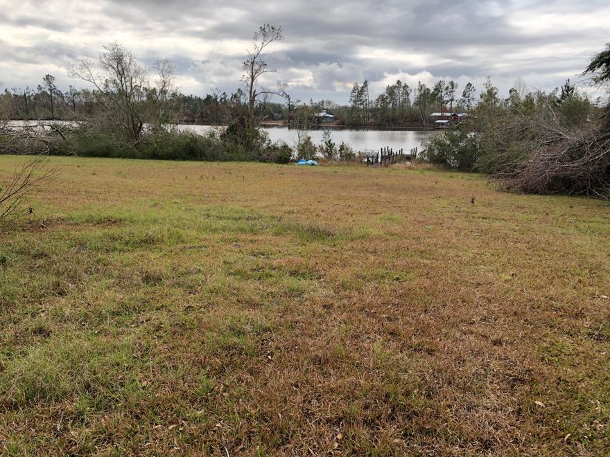 Beautiful waterfront one acre lot on one of the best lakes in the area. Already a dock for your enjoyment, ready for a new single built home or mobile home. There is a septic, well and power pole.   No gas motors allowed on this spring fed lake. The lake is called Highland Lake  and it is in Compass Lake Highlands. Value in Land only, no monetary  value in mobile home and seller is in the process of moving it off the property.