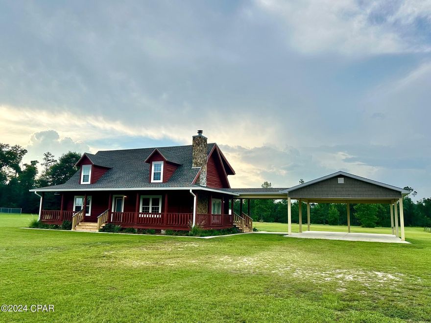 Fully remodeled, move in ready log cabin!!  This home sits on 4 manicured acres, a paved road, enjoys a Country setting, but still close enough to town for essentials.  This home features a new roof, new AC, new cabinets, new quartz countertops, new floors, new appliances, new French doors, new fixtures, new ceiling fans, gas stove, new instant hot water heater, now carport and a wood burning fireplace.   The yard is big enough for most anything.   The new carport is attached to the home with a walkway to stay dry or simply to add shade.  Come see for yourself if this home is right for you!!