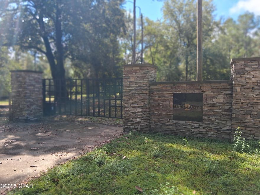Discover over 12 acres of natural beauty in the desirable Reedy Creek subdivision. This peaceful community has been thoughtfully preserved in its natural state, showcasing some of the most stunning topography in the Florida Panhandle. With only a few homes built so far, you'll enjoy both privacy and space to design your dream home surrounded by mature hardwoods and abundant wildlife. White-tail deer, fox squirrels, and bald eagles are frequent visitors. Outdoor enthusiasts will love the proximity to nearby springs, creeks, lakes, and the world-famous beaches of the Gulf Coast. A rare opportunity to create your own retreat among nature!