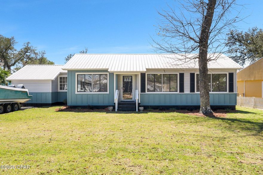 Charming 4-Bedroom, 2-Bath Home in The Cove! This beautifully updated home features a desirable split-bedroom floor plan, fresh paint, and solid wood flooring that enhances the bright and airy interior. The kitchen is both stylish and functional, featuring soft-close cabinets, butcher block countertops, stainless steel appliances, and spray foam attic insulation. Both bathrooms have been thoughtfully updated with sleek vanities, modern fixtures, and a well-planned layout. Step outside to enjoy the privacy-fenced backyard, complete with a brand-new wood deck—perfect for relaxing or entertaining. Nestled in the heart of The Cove, this home offers a true sense of community with access to top-rated schools, local parks, and waterfront activities on St. Andrews Bay. Plus, you're just a short golf cart ride from downtown Panama City's vibrant shopping, dining, and entertainment scene. Don't miss this move-in-ready 4-bedroom, 2-bath gem in one of the city's most sought-after neighborhoods!