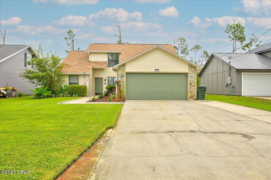 CURRENTLY UNDER CONTRACT, SELLER ACCEPTING BACKUP OFFERS. Walk in to a beautiful stone wood-burning fireplace, new vinyl plank flooring and a great floor plan for a growing family. The kitchen is open to the living room and features granite counter tops, custom cabinets, stainless appliances, breakfast bar and spacious pantry. There is plenty of room for a large dining table. The downstairs has 2 big bedrooms with a bath in between. Upstairs is the private master suite with large bedroom and master bath. The master bedroom has a big walk-in closet and master bath has double vanities and separate private area for the shower/tub combination. The backyard/patio area is truly an oasis! A beautiful pergola, privacy-fenced backyard, fruit trees, lots of grass and other trees and plants that give it a ton of privacy. Plenty of room for entertaining, grilling, hammocks, birthday parties or later add a swimming pool.  The home features a new roof, and new windows, and is located in flood zone X.  One more important feature is all of the storage in this home - under the stairs, pantry, linen and coat closets and attic storage. There is NO HOA dues in this subdivision but it is centrally located just minutes to grocery stores, the post office and walking distance to Mosley High School.