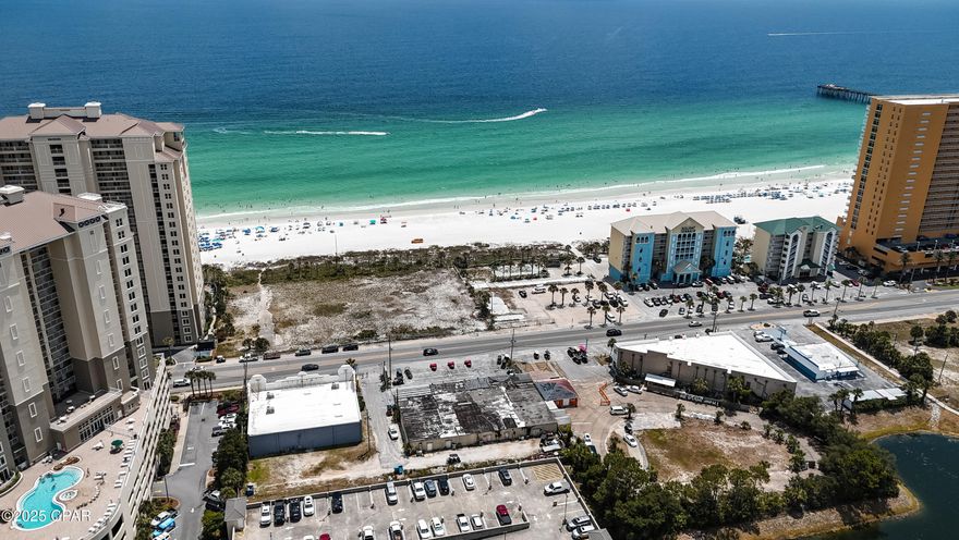 Looking to be on Front Beach Road between two active hub roads of Panama City Beach, Alf Coleman & Richard Jackson Blvd.  This property has so much potential for future development with over half an acre and 158 ft on Front Beach Road. Currently property across the street is undeveloped.  Current owner has a golf cart & sling shot business actively running in one of the end spaces.  The other end unit has an active tenant.  Zoning is CH Commercial High Intensity. Future widening of Front Beach Road has not been completed, but seller is working with the city to determine all the details.