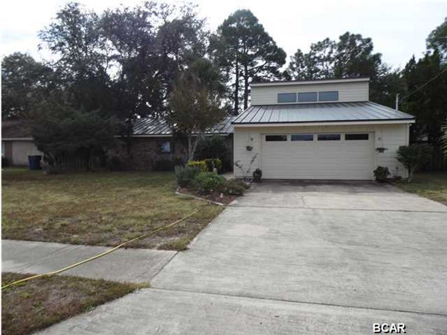 Looking for nothing to do but move in. It has all been done for you. Show your buyers this one. New metal roof 2013, new light fixtures. Owners take pride in their property and it shows. New paint inside and out. Very well maintained. Open family room with vaulted ceiling, vertical skylights and stone wood burning fireplace. Shaded lot with huge Oak trees. Convenient to shopping, schools and places of worship. All appliances convey except refrigerator and it is negotiable. Back fence has been raised to 8'