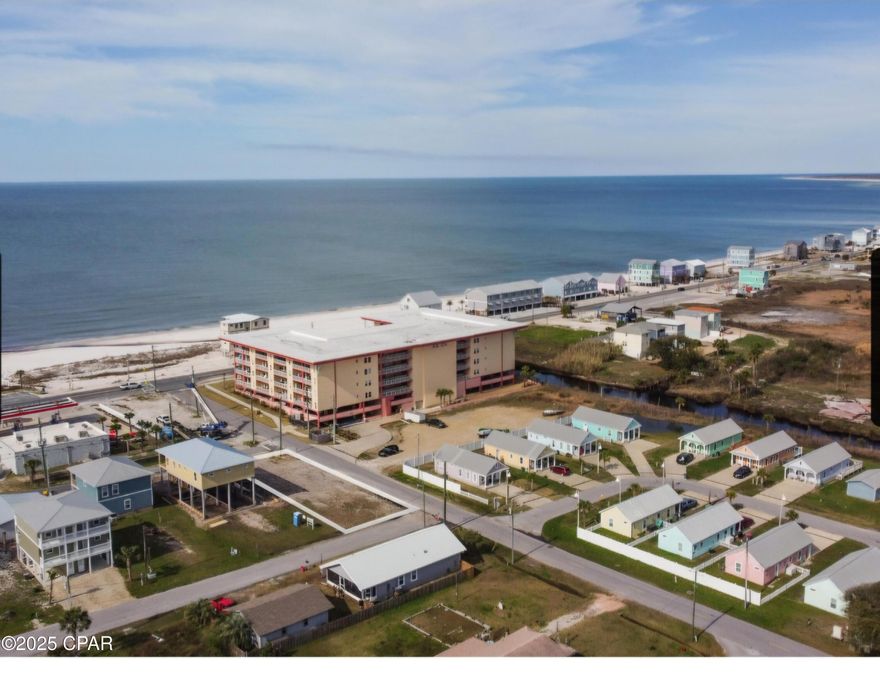 Ready to build corner lot with gulf views! Just one block from the beach, cross Hwy 98 for easy access to the sand and surf. Centrally located near Toucan's in construction. This prime spot offers the perfect opportunity to build your dream beach home or investment property. Enjoy coastal living and convenience.