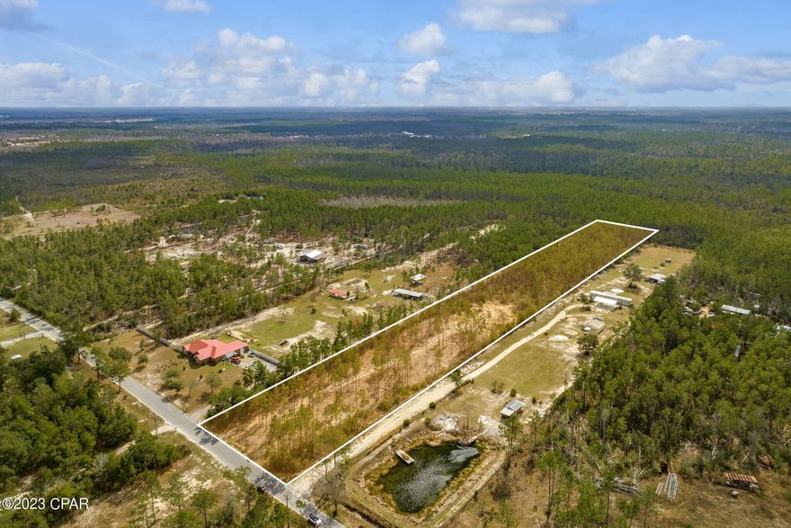 Come build your dream home on a quiet 5 acre lot in the up-incoming city of Southport, FL.  This property is not on a through street, utilities are already in place, and the lot has been partially cleared leaving plenty of trees on all sides for privacy.  You will have friendly neighbors, no flood insurance or HOA fees required, and will be just a 10 minute trip away from Lynn Haven for shopping, restaurants, and Bay access.