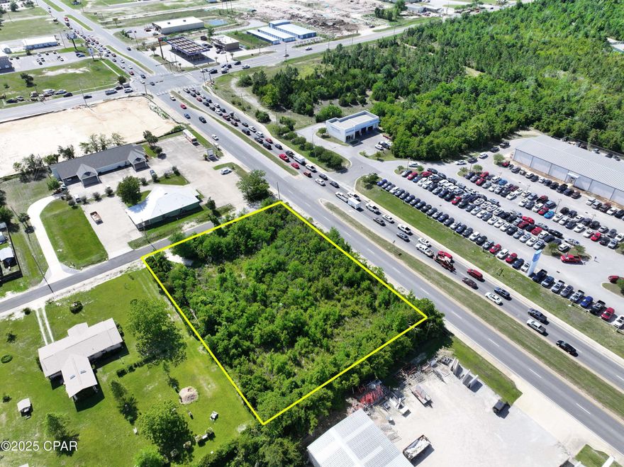 Prime Commercial lot located on Hwy 98(15th Str). This property features approximately 240' of frontage on Hwy 98 and is 43,200 sq ft(.99 acre).   Located on a very busy corridor that has over 40k vehicles pass per day and is located right across the street from the Bay Honda Dealership. Perfect for any retail, business, or office use.