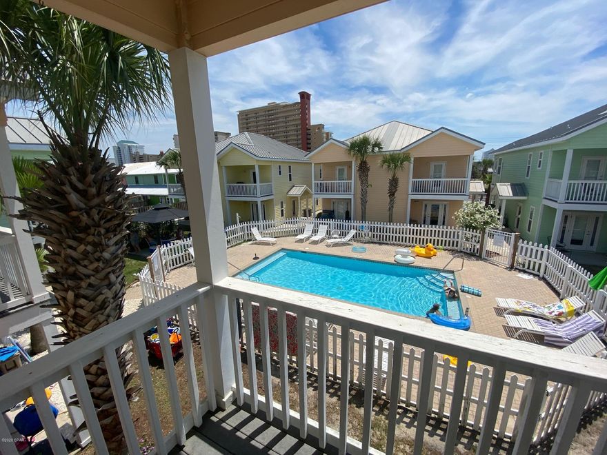 Sago Park Townhomes is a small unique community  consisting of 12 units and a pool about a 1 1/2 blocks to the beach. Very low HOA fee's of $134 per month. Zoning allows for this to be a vacation rental. The original owner has never rented this unit out. I looks practically new. Open upstairs living room with high12'' ceilings make this room homey but spacious. Well appointed kitchen with solid surface counters and large walk in pantry. The is a 1/2 bath conveniently located off the kitchen; Front and Back Balconies off kicthen and LR. Downstairs is the 2 Master bedroom suites. Both with full baths and large walk-in closets. W/D hook up in the downstairs all. Walk right out of the unit to the pool for a quick swim. Being sold furnished