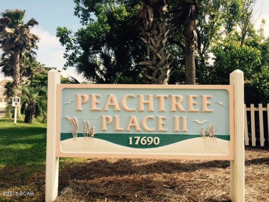 A very desirable ground level condo in a quiet peaceful area across from the Splash. This beautiful condo located at Peachtree Place II is only minutes from your toes feeling the fluffy white sands of the Gulf. Imagine those priceless sunsets awaiting you on The Most Beautiful Beaches In The World. Located on the prime first floor, you can drive your car to the front door, which makes unloading your vehicle much easier. The unit can sleep 6. A beautiful fenced in pool is only a few steps from your door. All information is approx. and should be verified.