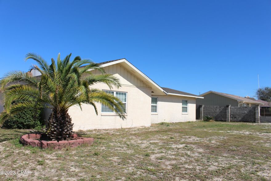 Excellent opportunity on the beach in desirable Treasure Island Subdivision.  Renovations on this 1980's home have already started, but are in need of completion.  Just 2 blocks off the beach on the east end South Lagoon Area. This one story concrete block home consists of the following: 3 bedrooms; 2 baths; living room; family room; kitchen; large laundry; sheds and .25 acres of land.  A boat or RV lovers dream with extra land area for storage.  But better yet, this extra large corner lot will allow another gated access driveway on the side to park a huge boat or RV with water & electric hookups. The home has a new roof, new water heater and new appliances. Portions of the home have been updated with the remaining home looking for an energetic partner to complete the project.  Home has new roof; new appliances; new kitchen; new vinyl plank floors; new bath with some projects yet to be completed.  Come take a look and bring your ideas for a home close to the beaches and a golf cart friendly community.  Short term rentals are allowed.