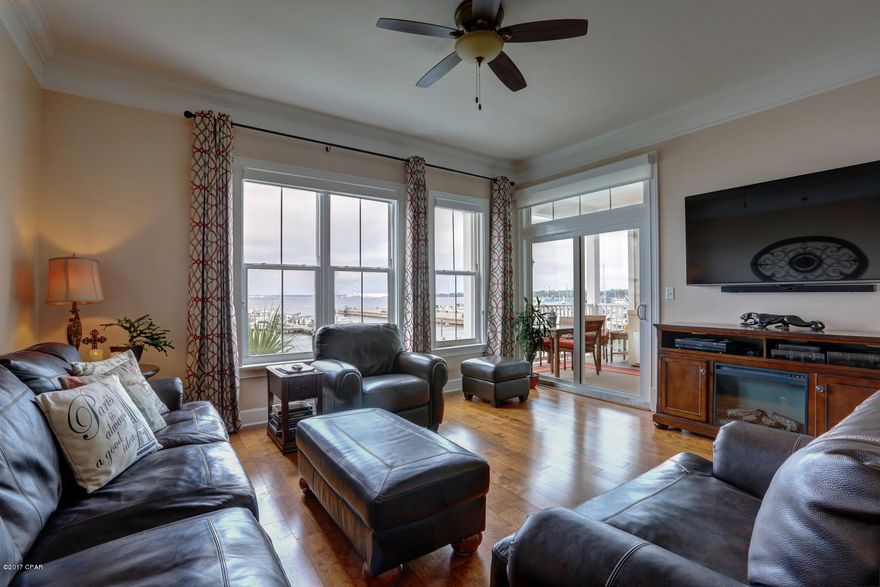 Immaculate two bedroom, two and half bath unit with expansive views of St. Andrews Bay.  This unit is located in a stack that has a unique balcony configuration for the complex giving better views and allows enjoyment of the cool evening sea breezes.  A summer kitchen adds to the great outdoor living space this large balcony avails. Updated stainless steel appliances, flooring, paint and storage turn this condo unit into a very livable, comfortable home.  Love the decor?  Consider buying the furniture also and make this move easy!  Harbour Village is a luxury condominium in a quaint walkable community in the historical bayfront area named St. Andrews.  The best local seafood restaurants can be found just outside your door. Bike paths, parks, boating and fishing.