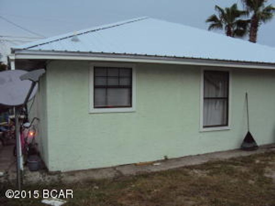 Your investors have waited long enough for this deal to come their way. This is an incoming producing property this duplex is close to a deeded beach access. Large yard close to shops and restaurants. Great Rental long term or short term This is a DUPLEX this is being SOLD as a duplex BOTH SIDES for this low price. Less than 1/2 mile to public boat ramp you can be boating to Shell Island in no time. Remember this is a DUPLEX there are 2 bedrooms/1 Bath per side. Total of 4 bedrooms 2 baths. The RENT is $800.00 per month per side $1,600. month for both sides. This is a deal of a lifetime. DON'T MISS THIS ONE. The rent is on the low side you could get at least $1,000. per unit.The Price has changed to reflect BRAND NEW METAL ROOF.