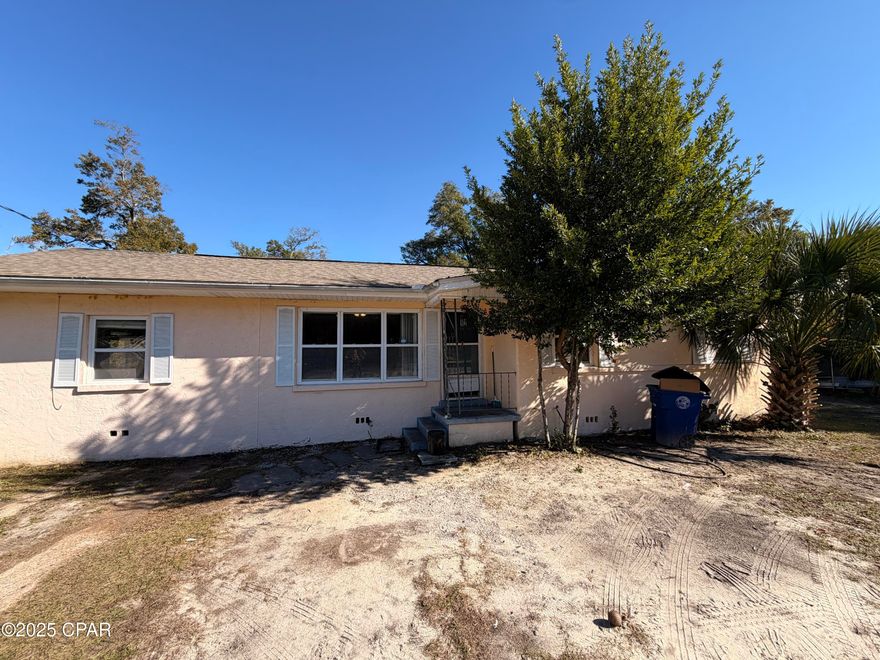 3-bed 1-bath home located in St. Andrews on a large, 1/4 acre fenced lot. 
Inside, the home offers a large family room and an additional Florida room with laundry area, providing extra usable space and storage. 
A wraparound deck extends along the side and back of the home, overlooking the backyard and offering outdoor space for everyday use.
home needs updates and repairs and is being sold as