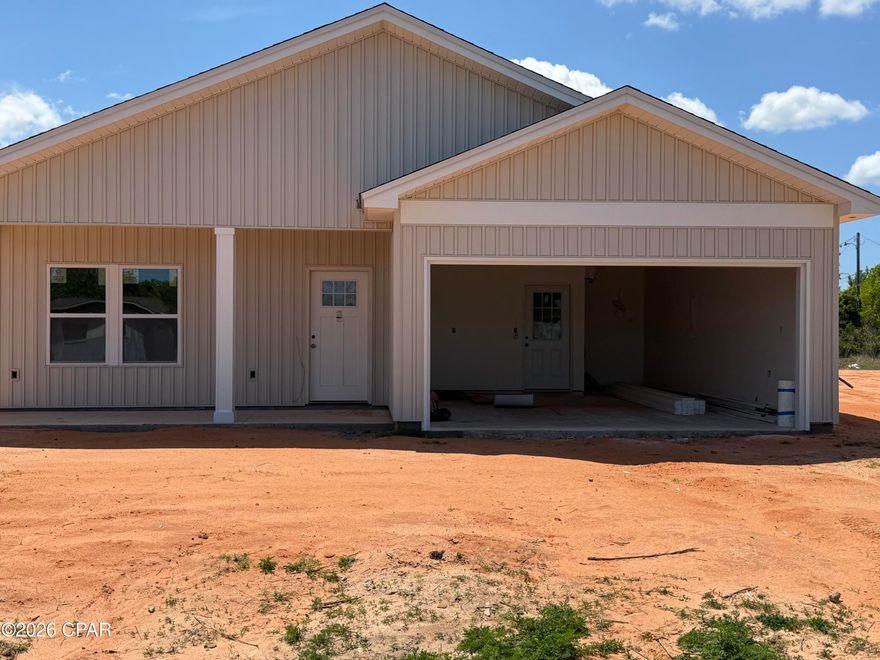 Under construction and nearly ready to impress! This brand-new 3-bedroom, 2-bath home is ideally located in Panama City. Designed with modern living in mind, the home features 9-foot ceilings and luxury vinyl plank flooring throughout, creating a bright and open feel. The open-concept living, dining, and kitchen areas flow effortlessly, making the space ideal for both everyday living and entertaining. The kitchen boasts granite countertops, stainless steel appliances, and a pantry, all overlooking the main living area. Tucked away for privacy, the primary suite offers a peaceful retreat with a double vanity, walk-in shower, and spacious walk-in closet. Two guest bedrooms share a full bath with a tub/shower combination. A convenient mudroom with garage access is located just off the kitchen, providing added storage and functionality. Also, FPL is currently installing underground power for Douglas Road and it should be completed this year.  Don't miss the opportunity to own a beautiful new construction home in a desirable location.