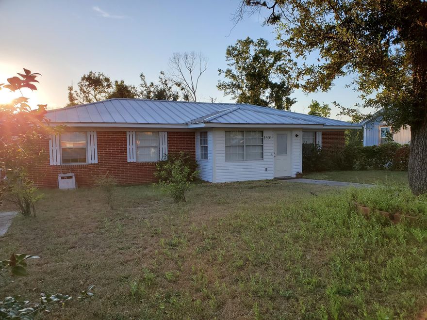 GREAT LOCATION!!  Historic St. Andrews!!  6 Total Bedrooms!!   The home is located in Historic St Andrews on a large corner lot just blocks from the bay, shopping and dining.  This Home features a Mother in Law Suite/Income Producing Apartment with it's own Exterior Access.  This 2 Bedroom, 1 Bath area could easily be separated to create an Income Producing Apartment and It  already has it's own Electric Meter.  The main house has 4 Bedrooms , 2 full Baths, Kitchen , Living Room/Dining Room combo and Laundry Room.  There is also a Bonus Room Between the Main House and Mother In Law Quarters that would make a great Office or Playroom.  The Home Features a Standing Seam Metal Roof that received no damage during the Hurricane.  Additional Features include a Generator and Covered RV Parking. Put this Home on your List of Places to See!!  Home is Being Offered For Sale AS IS.
