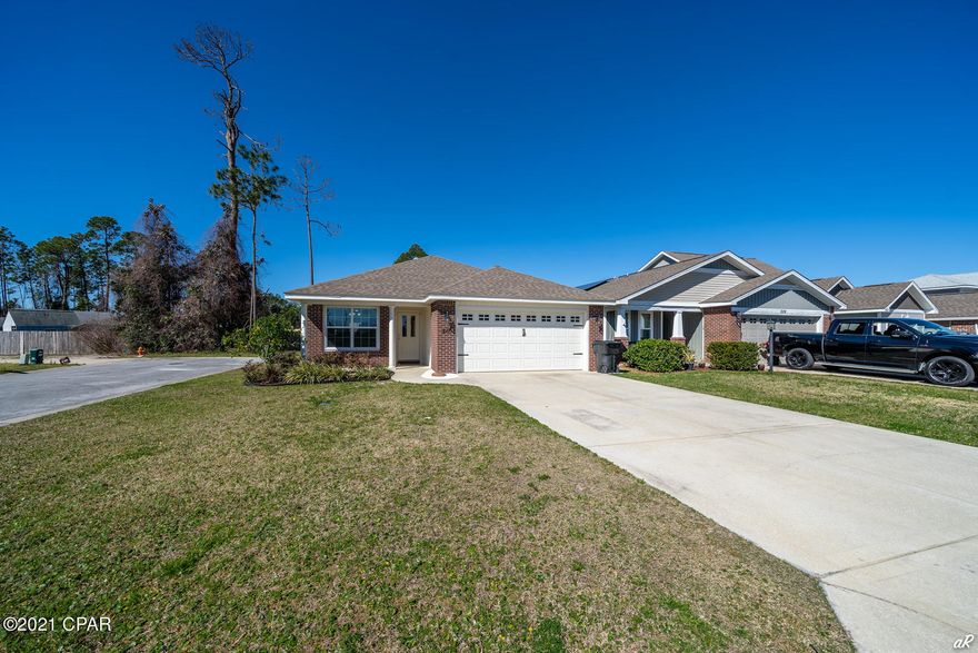 This conveniently located, 3 bedroom 2 bath home with 2 car garage is in the family friendly neighborhood of Woodlawn Village. This well kept home is on a larger corner lot. The home features all new LVP flooring throughout. Kitchen has solid surface counter tops,  brand new stainless appliances and custom cabinets that is open to a spacious and bright family room. As an added bonus there is a bar area for extra seating off the kitchen. The roomy master bedroom has 2 walk in closets and a private full bath. The other two bedrooms are a nice size with plenty of storage. New washer and dryer. Application is required before showing. NO PETS.