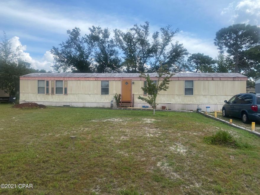 INVESTMENT OPPORTUNITY! Fix it up or tear it down and build a new home! This mobile home sits on a great size lot! The lot is beautiful and it has two large oaks in the back yard. Convenient location!