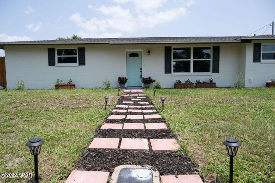 'CURRENTLY UNDER CONTRACT, SELLER WILL CONSIDER BACKUP OFFERS' Redwood Retreat is a beautifully remodeled 3 bedroom 2 full bath home walking distance to some of the best restaurants in Panama City Beach! A short 3 minute drive will take you to the beach or one of several marinas to rent jet skis, pontoons or book that charter fishing trip. The new sports complex is also just minutes away and a short 15 minute drive will get you to Pier Park for shopping and other entertainment. This home is very spacious and has a large backyard and private office. All three bedrooms are very large and the master suite features a large walk in shower. There is also a bonus room that can be used for an office or playroom. Kitchen appliances are all higher end and one year old. Roof is only 2 years old. This home is concrete block making it very energy efficient. This home sits on a large corner lot with the backyard being fenced in and there is also a nice work-shop/storage area. Can be used as a short term rental, second home, investment property or a primary residence.