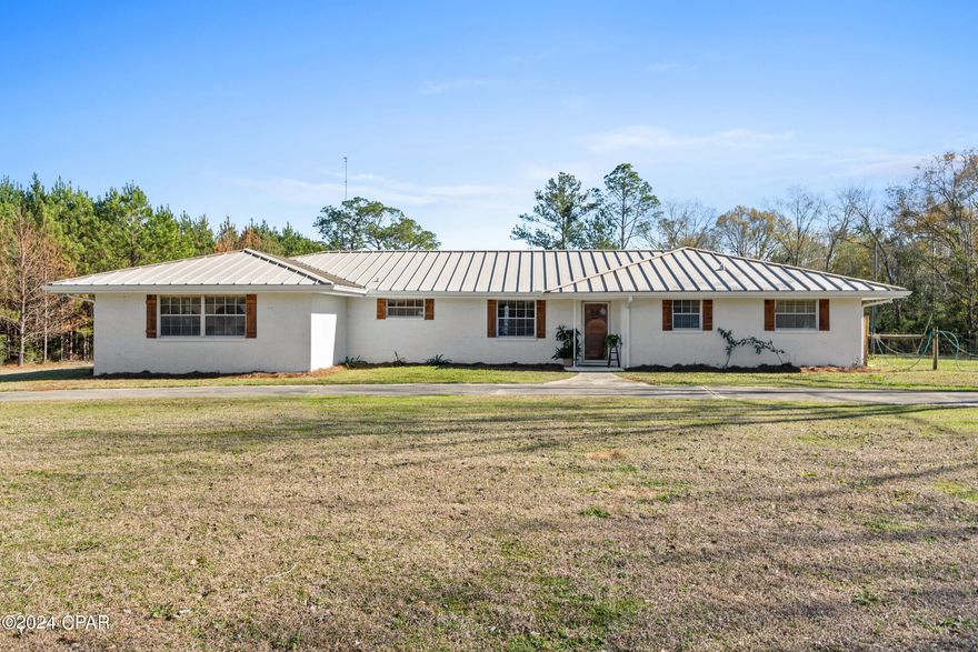 Discover the perfect blend of rustic charm and modern potential on this captivating 10-acre property situated along a paved road. A focal point of this slice of paradise is the well-stocked pond that graces the landscape, offering peaceful moments and recreational opportunities right at your doorstep.

The 1959-built residence, with its solid block exterior and durable metal roof, exudes timeless character and durability. Inside, you'll find a spacious 4-bedroom, two-bathroom layout, providing ample space. Recent updates have already enhanced the property's appeal, 

The property also boasts the convenience of a large pole barn (approx 74x40) and another barn 50x50 offering numerous possibilities for hobbies, storage, or even a workshop. Enjoy your afternoon fishing the over 2 acre pond.

This listing represents more than just a home; it's a canvas for your dreams and aspirations. Imagine waking up to the serene views, enjoying the bounty of your pond, and knowing that you have the potential to create the ultimate rural retreat.