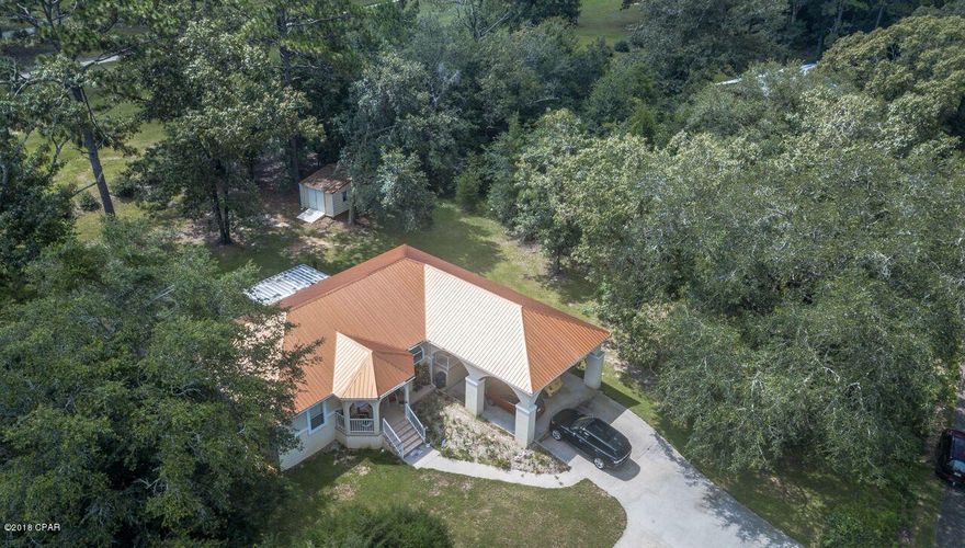 Spacious Custom Built Home on the Dogwood Lakes Golf Course with NO HOA FEES. Inside this stunning 3 bedroom, 2 bath home, you will be welcomed with a large open layout that is ideal for family gatherings. The home features a split floor plan along with a spacious kitchen island with Stainless Steel appliances and breakfast bar. Great view of golf course in back. Large screened in back porch that overlooks the Golf Course. Roomy 12x 24 Golf Cart shed/ storage shed.  Take advantage of the clubhouse that offers hot/cold sandwiches, snacks, and beverages of all sorts. As you drive your cart around each bend, prepare for another breath taking view. With five miles of rolling fairways, natural water hazards, and challenging sand traps, this 18 hole par 72 golf course is one of the most exciting and challenging you will find anywhere! $25.00 Green Fees includes Golf Cart. Age, SF lot and room sizes are approximate. Please verify if important.