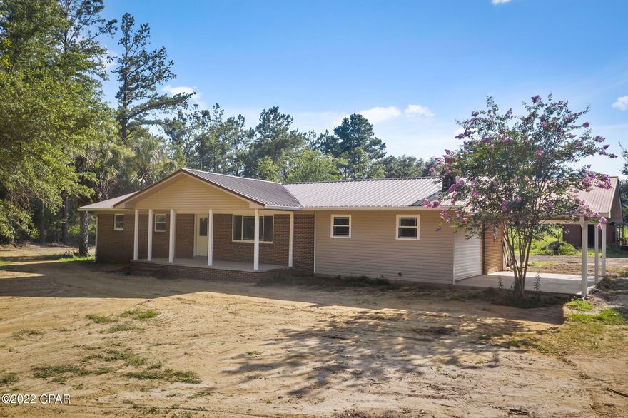 The feel of country living, but just off a paved road.  Don't let the age of this home fool you!  This home has been renovated!  This four bedroom home is situated on 2.3 acres and has an attached carport.  The kitchen features new stainless appliances, granite countertops, and an island.  The living area is open concept.  Nice large master suite.  Master bath has a nice tile shower.