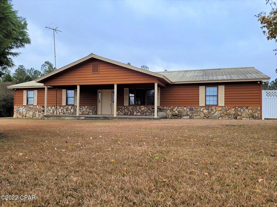 CURRENTLY UNDER CONTRACT, SELLER ACCEPTING BACKUP OFFERS.  Beautiful 3-bedroom, 2 full bath home on 2.65 acres in the country.  If you are looking for peace and quiet, then this is the home for you. The kitchen is designed for maximum space and has solid birch cabinets.  All lower cabinets come with pull-out drawers for easy access. Comes with stainless steel appliances to include LG Stove, LG Dishwasher, and Refrigerator with Ice Maker and Freezer.  Large dining area. Huge living room with bay window overlooking the front yard. Master Bedroom has a walk-in closet and remote-control light/ceiling fan.  Master Bathroom has a walk-in shower and will accommodate a wheelchair.  Beautiful Florida Room on the back of the house has windows overlooking the back yard and a separate entrance door. Beautiful Florida Room on the back of the house has windows overlooking the back yard and a separate entrance door.  There is a 6'x20' room on one side of the carport that is set up for an office with extra outlets.  On the other side of the carport is the 8'x20' laundry room with shelving and a new water heater.  Covered porch on the back of the house perfect for enjoying that morning cup of coffee. Comes with a huge 56'x24' Barn with water and electricity and a side shelter on each side. Nicely landscaped yard with camellias, azaleas, magnolias, and cedar trees.  There is a row of azaleas along the front of the yard that provide privacy and will be amazing when blooming. This home is in great condition and is move-in ready.  Located 20 minutes from Geneva, AL and approximately 1 hour to Panama City beaches and International Airport.