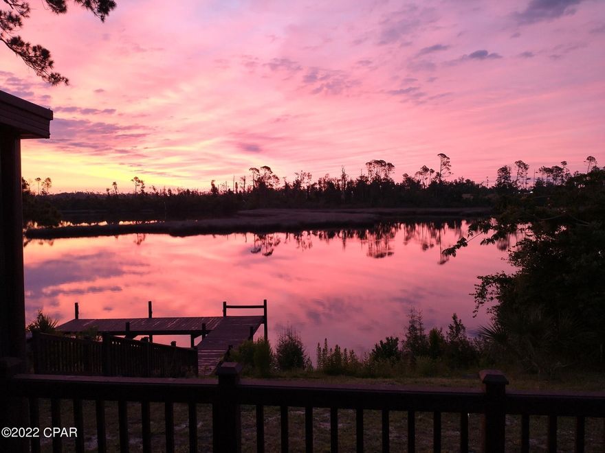 UNDER CONTRACT WITH CONTINGENCIES; SELLER ACCEPTING BACKUP OFFERS.

Absolutely stunning executive home located on a 0.29 +/- acre waterfront lot in prestigious Shadow Bay, one of the most desired waterfront neighborhoods in Panama City.  There is a newer dock on the property that allows great fishing opportunity, with deep-water access to St. Andrews Bay, Shell Island, and the Gulf of Mexico via small watercraft.  The sunrises from the back porch and dock of this home are absolutely breathtaking and paint a picturesque sky and backdrop for this amazing home.

Meticulous maintenance and attention to detail is exhibited in every square inch of this home (see MLS for more). The roof was replaced in 2019, and there is a newer screened patio, deck, exterior and interior paint, carpet, granite countertops, and remodeled master bath shower.  The breaker panel was updated in 2020, and the home is wired for a generator.  

This home flows seamlessly with a split bedroom plan, with two guest bedrooms on one side of the home and an expansive master bedroom with large his-and-hers closet on the opposite side of the home.  The main living areas have LPV flooring, with tile in the foyer and kitchen, and newer carpet in the bedrooms.  The master bedroom has a private door which opens directly onto the back porch.  There is also a two-car garage off the laundry room.

This home was built for entertaining - as you walk into the foyer, you step down into the living room which opens onto a screened porch that is perfect for that backyard barbecue, and to the left is the gourmet kitchen with dining area.  The kitchen is equipped with stainless steel appliances, granite countertops, and custom cabinets.  A few steps from the porch is a hot tub overlooking the calm bayou, where you can watch the graceful dolphins when they make their surprise appearance.

You have to see this home to appreciate the custom craftsmanship and meticulous attention to detail by the owner.  There has been so much hard work poured into this home, that a new owner is going to step into a waterfront paradise and the perfect home.  Schedule your viewing today, and prepare to be amazed!