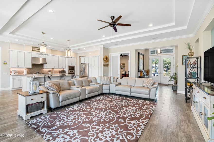 This property has sold! Discover similar listings by reaching out to us for an updated list of available properties that match your preferences. **FOUR LARGE BEDROOMS WITH BONUS/OFFICE SPACE** This custom Arthur Rutenberg home is located in the exclusive, gated community of The Preserve on The Bay, where 24-hour staffed security ensures privacy and peace of mind. Built in 2019 and impeccably maintained by its single, pet-free, non-smoking owner, this home feels practically brand new. The thoughtfully designed split floor plan offers both openness and privacy, with a spacious primary suite tucked away on one side, featuring a luxurious bathroom with a walk-in shower, dual vanities, and an enviable custom closet. The three additional large bedrooms are on the opposite side, with two sharing a bath and one enjoying its own private ensuite. A versatile bonus room provides the flexibility to create a home office, entertainment space, or playroom. The gourmet kitchen boasts a five-burner gas cooktop, quartz countertops, a large island, abundant cabinetry, and a vent hood. A separate laundry room with a sink and space for an extra fridge adds even more convenience. Natural light pours in through a stunning four-panel sliding glass door that opens to the screened-in travertine lanai, overlooking the expansive .66-acre backyard - lush, private, and surrounded by mature trees and protected green space. This home is as energy-efficient as it is beautiful, featuring paid-off solar panels that keep utility costs impressively low - the average electric bill is just $45 per month and, there is even a well for the irrigation system.Additional smart energy features include foamed insulation and a Rinnai tankless water heater. The three-car garage, complete with EV charging and overhead storage, rounds out this exceptional home. A rare opportunity to own in one of Panama City Beach's most sought-after communities - schedule your private tour today.