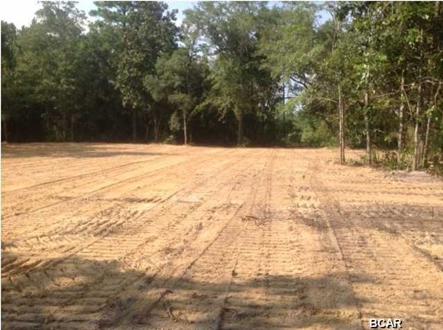 Fully cleared and ready to build. Great views of the Bayou and with 200 ft of shore line, you would have plenty of space for dock. Has access to west bay, Shell Island and the Gulf.