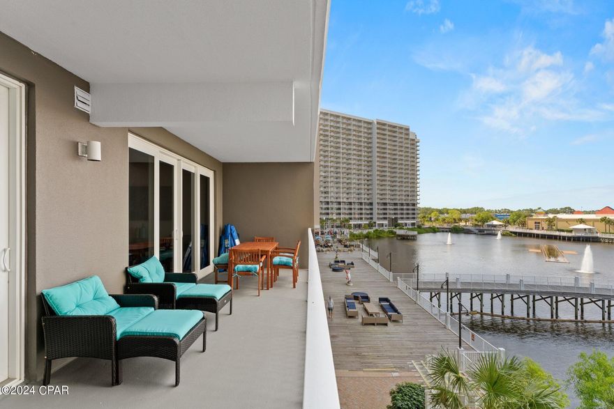 Experience coastal living at its finest in this beautifully updated 2-bedroom + private bunk area, 2-bath lakeview condo at Laketown Wharf Resort in the heart of Panama City Beach. Ideally situated on the convenient 2nd floor--no elevator needed--this turn-key, fully furnished unit is already performing as a strong rental and offers the perfect opportunity for investors or those seeking a stylish second home with income potential.

Freshly painted and thoughtfully upgraded throughout, the interior features new luxury vinyl plank flooring (no carpet), new mattresses, ceiling fans, extra recessed lighting in the hallway and kitchen, and a new light fixture over the kitchen island. The kitchen is both functional and stylish with granite countertops, a tile backsplash, new faucets, stainless steel appliances, and added conveniences, including an Instant Pot and air fryer. The open living space flows seamlessly onto an oversized balcony overlooking the serene lake--complete with beautiful teak patio furniture--perfect for morning coffee or evening relaxation. The sleeper sofa includes an orthopedic mattress for added guest comfort, and extra bedding is provided in every bedroom.

The spacious primary suite offers direct balcony access and features a large ensuite bath with dual vanities, a soaking tub, and a separate walk-in shower. The guest bedroom and private bunk area (with stylish barn doors) share a second full bath, allowing the condo to comfortably accommodate up to eight guests. Custom blackout curtains in every room ensure privacy and restful nights, while dedicated storage space makes it easy to keep beach gear organized.

Laketown Wharf delivers a true resort experience with five pools, a 52,000 sq. ft. lakefront boardwalk, Gulf-view fitness center, onsite dining, bowling, kids' playground, covered garage parking, nightly fountain shows, and direct beach access just across the street. HOA dues include water, sewer, cable, WiFi, and access to all amenities (electric billed separately).

Whether you're seeking a vacation getaway, full-time coastal living, or a high-performing rental investment, this updated and move-in-ready condo offers convenience, comfort, and unbeatable location all in one. Schedule your private showing today.