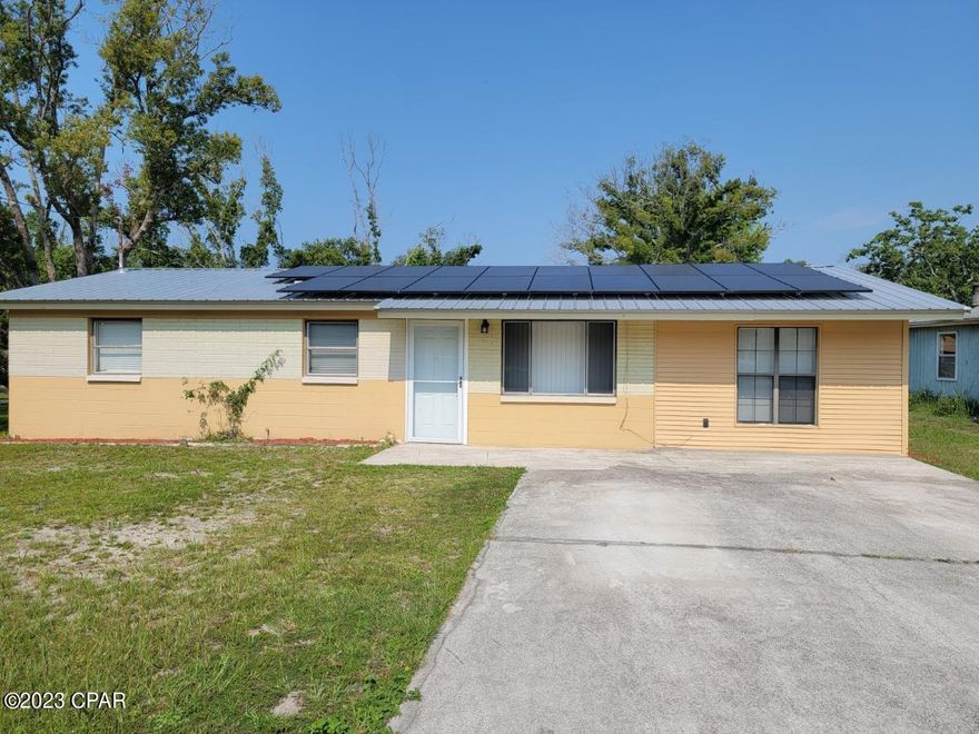 This home is solid block construction, clean, fresh paint inside and out.  Nice open living, dining and kitchen, area.  The hall leads to bedrooms and centrally located to bathroom. Nice Den, plus utility room with washer and dryer connection. There is a separate deck for cooking out, plus a big 24x24 workshop. The home features Solar Panels and will be paid off at closing.

Convenient to shopping on 15th St and 23rd St  as well as St. Andrews area of Panama City. Short drive to the beaches too.