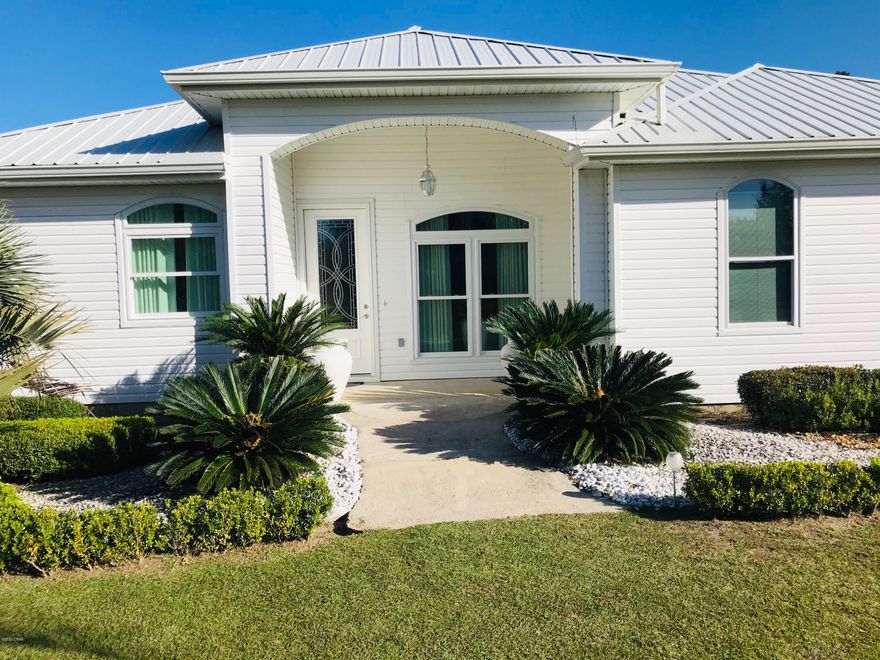 Beautiful country estate on 2 acres just minutes from I-10 and shopping.  On a dead end road, this 2350' move in ready home has 4 bedrooms and 3 large baths has a large family room and a large living room/dining room.  The layout of this home is very desirable for a family.  New quartz countertops.   Wood-like ceramic tile throughout the home, 9' ceilings, windows like new, roof 7 years old and beautiful lighting.   The property has a small pond at in the back of the property and part of the Bridge Creek runs on one section.   This is a must see and will not last long on the market.  Make an appointment today!