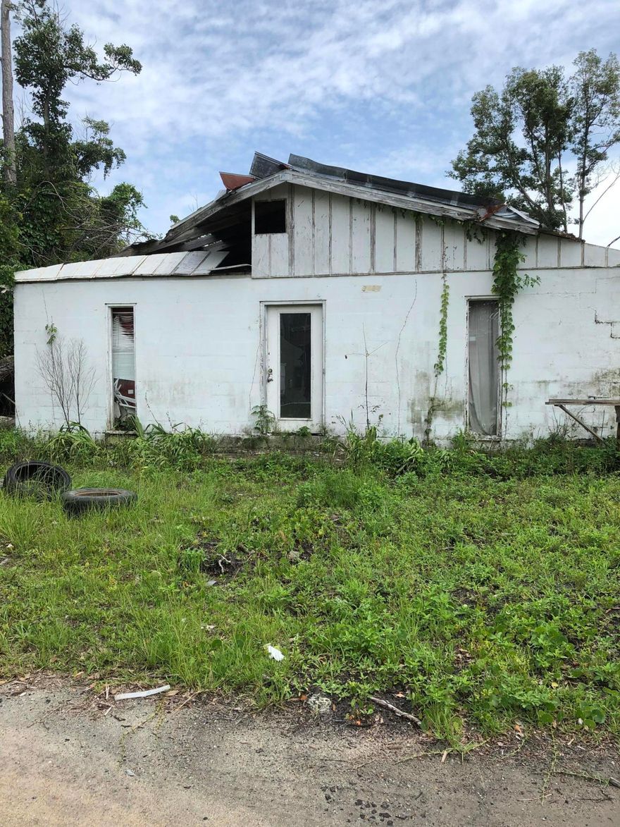 Great investment opportunity. Two homes are on the property. Both have hurricane damage and needs repairs. Has 3 sheds as well.  Property to be sold as is. Buyer to verify all pertinent information including the sq. footage and lot dimension.