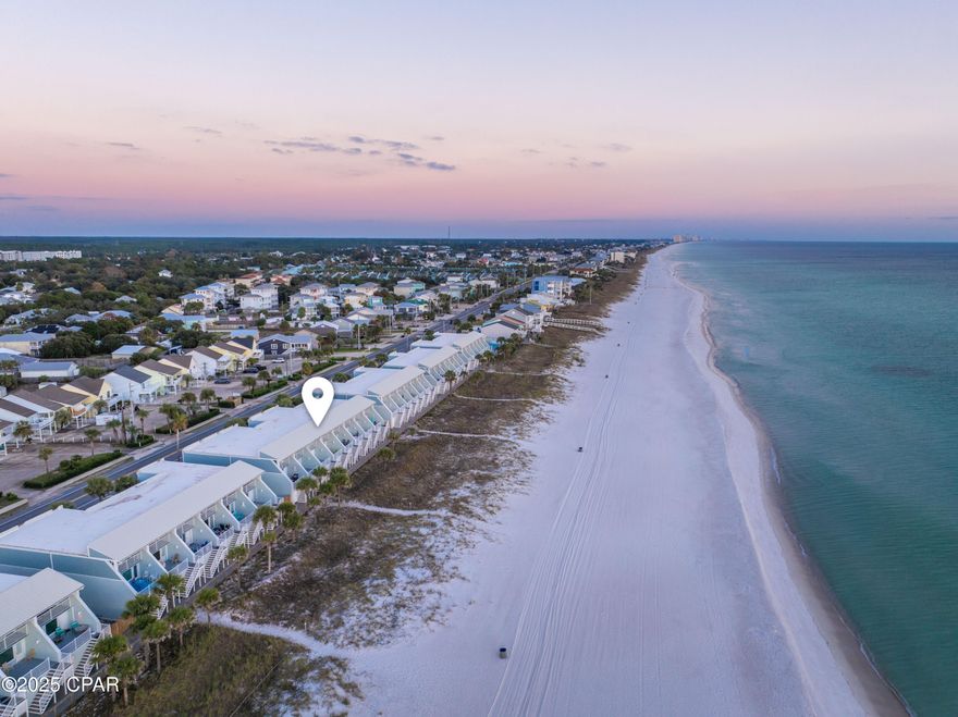Experience beachfront living and strong rental potential in this beautifully updated 2-bed, 2-bath Gulf-front townhome on Panama City Beach. This turnkey, fully furnished unit comfortably sleeps up to 8 guests, featuring a sleeper sofa and a unique bonus bunk room hidden inside the primary walk-in closet—a guest favorite and revenue booster.

Inside, the property has been thoughtfully renovated with high-end finishes including Florida Tile shower systems with ceiling-to-floor tile, upgraded vanities, modern lighting, and stone countertops. The primary suite offers double vanities with a dedicated makeup station, linen tower storage, a walk-in closet, and private balcony access overlooking the Gulf with unobstructed views.

On the main living level, large windows frame breathtaking water views from both the living room and kitchen. This level also offers balcony access with direct beach pathway access, a nicely sized pantry, laundry, a guest bedroom, and a fully renovated second bathroom.

The ground level includes a functional tandem two-car garage, two spacious storage closets (ideal for owner storage, beach gear, or housekeeping supplies), and another door leading straight to the beach path—no elevators, no crowds, just toes-in-the-sand convenience.

Whether you're seeking a coastal home, vacation getaway, or a high-demand rental investment, this property delivers the rare combination of updated interiors, strong rental performance potential, and true beachfront living with zero obstruction to your Gulf view.