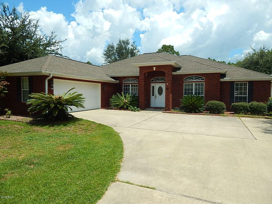 HUGE $29k PRICE REDUCTION on this Beautiful Brick executive home on large lot near Deerpoint lake boat landing with a easy commute to Tyndall AFB and Shopping. RV/Boat Parking area that will hold large RV or Boat. Home features sweeping arches,crown moldings, formal dining room, breakfast bar and eating area, Spacious open floor plan, high ceilings, fireplace, custom hardwood kitchen cabinets, pantries, Laminate floors and Split Bedroom Floor plan with large Master Bedroom suite. Master Bedroom is expansive, with oval jetted tub, HIS/HERS walk-in closets, double sink vanities, and glass stand alone shower. Large screened room off the kitchen.There is a Yard building with roll up door to store all your lawn or boating equipment. You will really enjoy the serene and peaceful area the home is located . All measurement are approx and should be verified by the buyer if important.