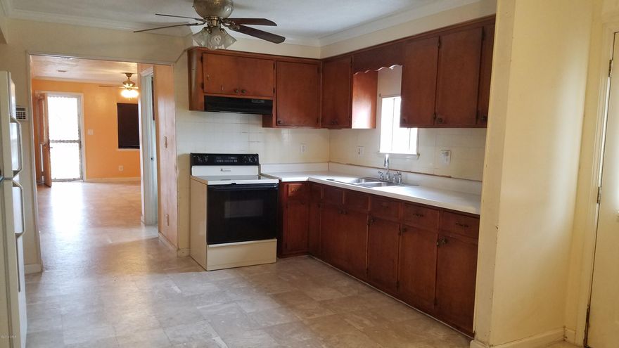 BACK ON THE MARKET WITH UPDATES! Spacious lot. just shy of 1/2 acre.  3 bed/2 bath with NEW ROOF replaced after Hurricane Micheal. Living room had sheet rock replaced and painted. New Floors, updated master bath. Large laundry room. HVAC only 3 years old,  Concrete foundation already laid for shed in yard, with electric connection

RV hook-up, with accessible driveway entrance. partial chain link fence, and still a few trees left in this HUGE back yard. Great Rental opportunity or primary residence. convenient to downtown, boat launches, grocery stores, schools and parks.