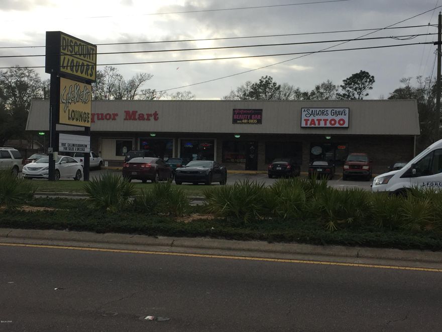 4 COP Liquor license being offered with sale. 16,400 Sq. Ft. commercial building located on Tyndall Pkwy near Hwy 22, in the heart of the busiest commercial market--traffic count 39,100. This property has approximately 223' frontage on Tyndall Pkwy. Property zoned general commercial. A loading dock with metal roll-up door at the back entrance to the building can accommodate a semi-truck. The property offers central A/C, electricity, public water & sewer, cable and telephone services. Age, square footage and dimensions are approximate. Both tenants under 3 yr lease. Inventory list available as well as rent roll. Please verify if important. Adjacent 0.606 acre property included. Won't last long!