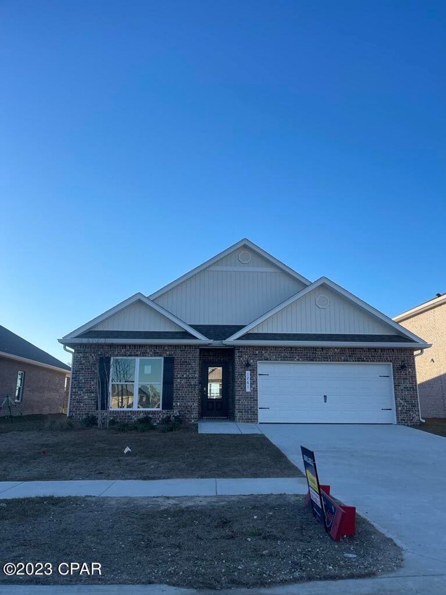 Andrews Park is centrally located off 389 in the very desirable area off Lynn Haven. Our Rhett floorplan is all brick, 4-bedroom 2-bath, it is an open concept floor plan, with a boasting 1,835 sq.ft.  The Rhett floorplan has upgraded finishes throughout. You will find 9-foot ceilings with 10-foot trays and beautiful crown molding. The Rhett also has LVP flooring, granite countertops, a large kitchen island with cabinetry on both sides underneath and brushed nickel hardware.  This floorplan has energy efficient windows to allow lots of beautiful natural light.  The primary bathroom has a beautiful garden tub, perfect for relaxing, and a spacious walk in shower with a glass enclosure. All of these homes come with Deako lighting and Safe Haven smart home systems. Andrews Park homes feature irrigation systems with reclaimed water to help minimize your water expenses. All homes come with a landscaping and sod package as well as gutters. This particular home comes with our move in package:  window blinds, Whirlpool appliances including refrigerator, washer and dryer.