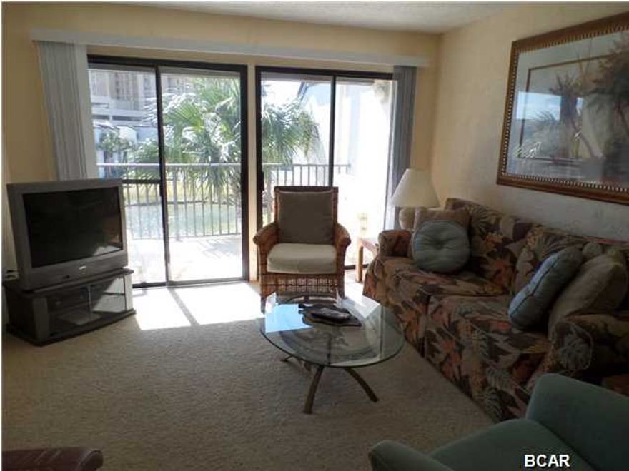 10% down for primary or second home and 15% down for investment property offered through Supreme Lending. Fully furnished and rental or enjoyment ready ...this 2 bedroom, 2 bath condo at Sugar Beach is just what you 've been looking for ... over 1,000 sq ft and its under $150k!! Priced to sell, this condo is perfect for a family getaway spot or for the investor looking for a great rental. This condo has a washer dryer in the unit and lots of storage space inside and out. Sugar Beach is a low-rise condo property located on Thomas Drive and offers tennis courts, a club house, a dedicated beach and pool and gated entry. It is beautifully landscaped and features a small lake with fish & ducks. This is an absolutely fantastic place at an amazing price .. contact your Realtor today to come