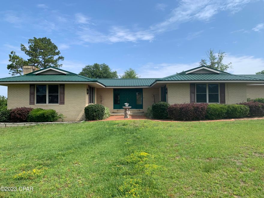 Beautiful 3 Bedroom, 2 Bath Home on 1 Acre in the well-established Green Meadows Subdivision.  When entering guest will go through a courtyard entry into a large kitchen and dining area.  The kitchen includes black granite counter tops and all stainless-steel appliances.  Off the side of the dining room is a beautiful 26 X 18 family room with a fireplace, perfect for entertaining.  The home has three good size bedrooms and a large utility room with plenty of closet space and storage.  Directly through the kitchen you have a large glassed finished room for additional family space and a deck that runs the length of the room, providing the ultimate space for outdoor entertaining.  This space also includes its own hot tub room.  The yard has a detached two car garage with work benches and an additional storage building and carport for any utility vehicles or projects.  Part of the back yard off the house is fenced for your animals and has a separate chicken coop, just in case you fancy a little farming.  Close to the Downtown shops and restaurants and just minutes from all Marianna schools and recreation, such as the Marianna Sports Complex, Chipola River, Citizen's Lodge and the Florida Caverns State Park.   Make an appointment today to see all this property has to offer.