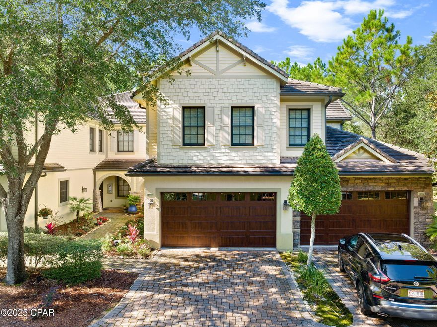 Enjoy the perfect blend of comfort and elegance in this beautifully designed and decorated downstairs unit overlooking the 9th tee and fairway. This spacious 3-bedroom, 2-bathroom residence features an open and inviting floor plan with an abundance of natural light and picturesque golf course views from the main living areas.

Step inside to find stylish finishes and thoughtful design details throughout. The living and dining spaces flow seamlessly to a screened patio—ideal for relaxing or entertaining while taking in the peaceful scenery. The 2-car garage offers ample storage and convenience, while the surrounding mature landscaping enhances the home's private and tranquil setting.

Located in the sought-after Clubside II Wild Heron community, residents enjoy maintenance-free living in a pristine golf course environment just minutes from shopping, dining, and the clubhouse.

Experience refined coastal golf course living at its finest!

Access to Sharks Tooth Golf Course, The 3rd Golf Course, and The Sharks Tooth Clubhouse are accessible with a Watersound Club membership. Please inquire with any questions.