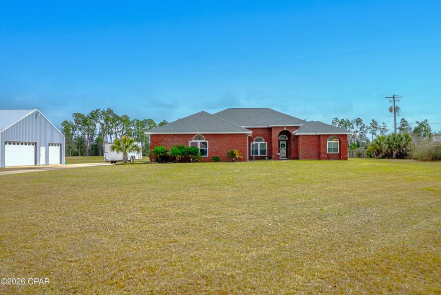 Stunning 4-Bedroom Home on 3 Acres!

Your Private Entertainment Paradise

Wake up to morning coffee overlooking your 3-acre sanctuary. Work from your dedicated home office. Lunch by the pool. Afternoon entertaining on your enclosed patio. Evening relaxation in your hot tub under the stars. This meticulously renovated all-brick estate isn't just a home--it's a lifestyle.

The Grand Welcome

Step through the front door into a sophisticated open floor plan. A formal dining area flows seamlessly into a spacious kitchen with custom lighting and abundant cabinetry. The kitchen opens directly to the family room's built-in entertainment center and shelving--the perfect entertaining hub where guests naturally gather and create memories.

Split Floor Plan Luxury

Exceptional privacy and flexibility define this home. The master suite features direct pool access, double vanities, and a luxurious Jacuzzi tub. The 3rd bedroom works as a guest suite or second master with its own full private bath and patio access. Two additional full bedrooms, plus a dedicated office for remote workers or hobbyists, round out the living spaces.

Outdoor Living at Its Best

Your Grecian-style heated pool with waterfall and hot tub creates year-round enjoyment. The large enclosed, tiled rear porch provides weather-protected entertaining space. A newly installed privacy fence (coming soon) ensures complete seclusion on fully cleared acreage--your own private retreat.

Storage & Hobby Space

The immaculate 693 sf garage plus attic storage accommodates multiple vehicles, boats, and RVs. An additional impressive 30' x 36' detached garage provides exceptional space for workshops, hobbies, or collections--perfect for enthusiasts and collectors.

Premium Features

Fully renovated with updated appliances, flooring, fixtures, and paint
Rain Soft water system for superior water quality
Automatic sprinkler system for effortless landscaping
Custom ceramic tile, carpet, and LVP flooring throughout
Move-in ready!

The Lifestyle

Whether hosting elegant gatherings, enjoying family time, working from home, or creating lasting memories--this home delivers on every level. Multigenerational living, entertaining, relaxation, and privacy all in one beautiful package.

Your personal sanctuary awaits. A true MUST SEE!

All measurements approximate; please verify for accuracy.